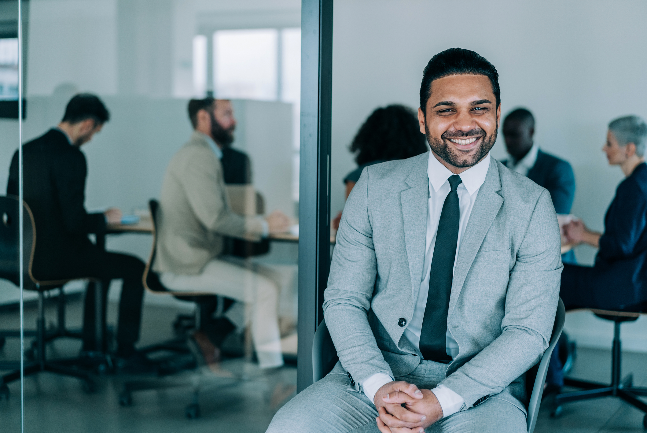 GettyImages 1365436556 Business man smiling