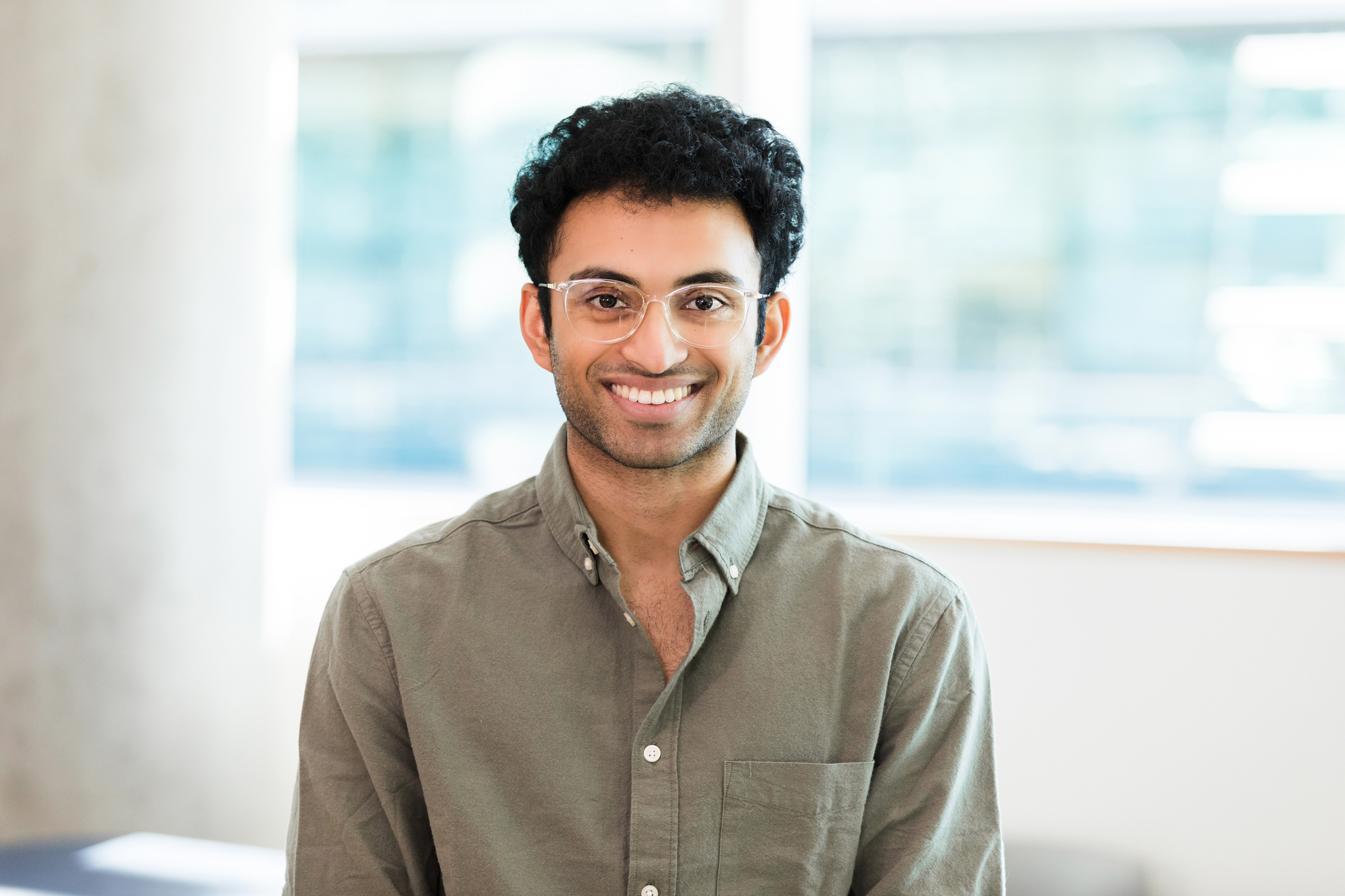 Confident Young Man Smiling in Casual Wear, Portrait